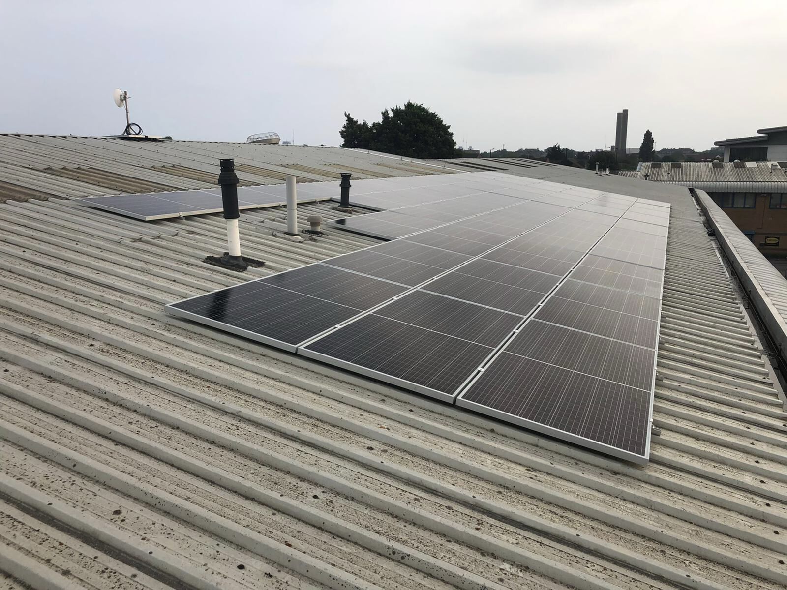 Solar panels on a metal roof at an Integral Memory PLC facility