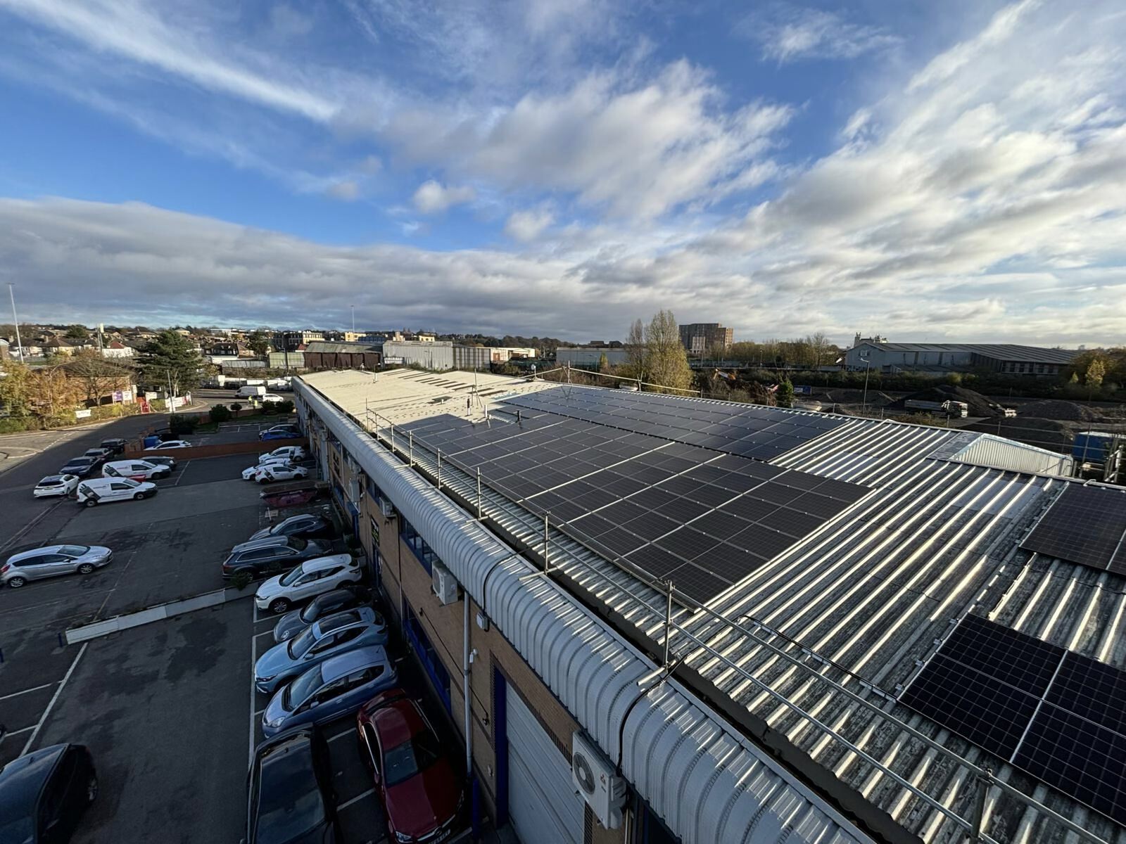 Aerial view of an Integral Memory PLC facility with rooftop solar