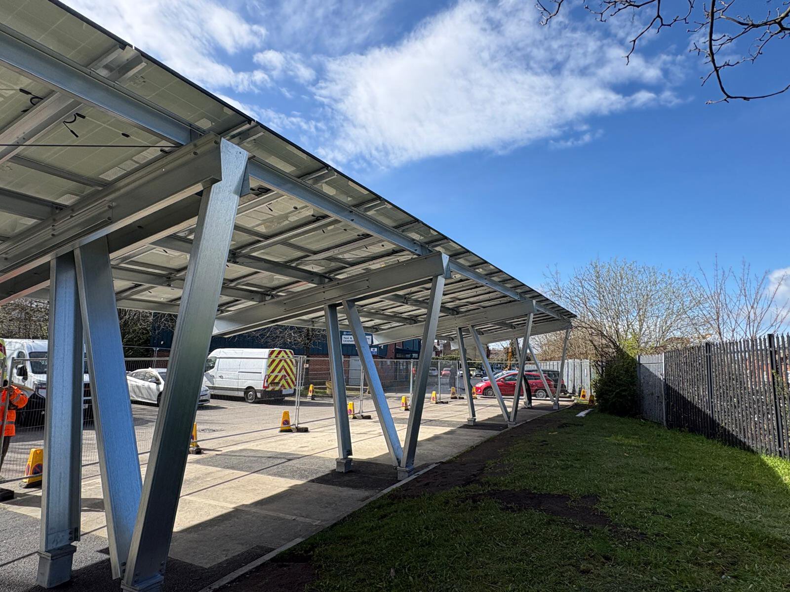 Solar carport canopy over parking spaces